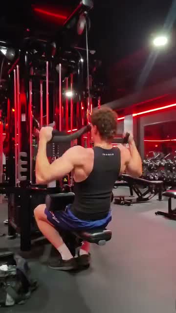 Sam performing a lat pulldown